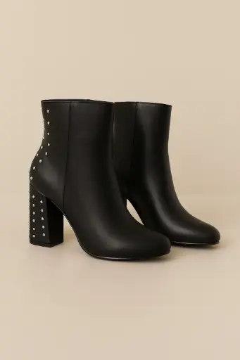BOTAS EN CUERO NEGRAS TACHES TACÓN